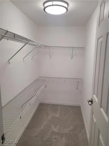 a bathroom with a granite countertop toilet sink and shower