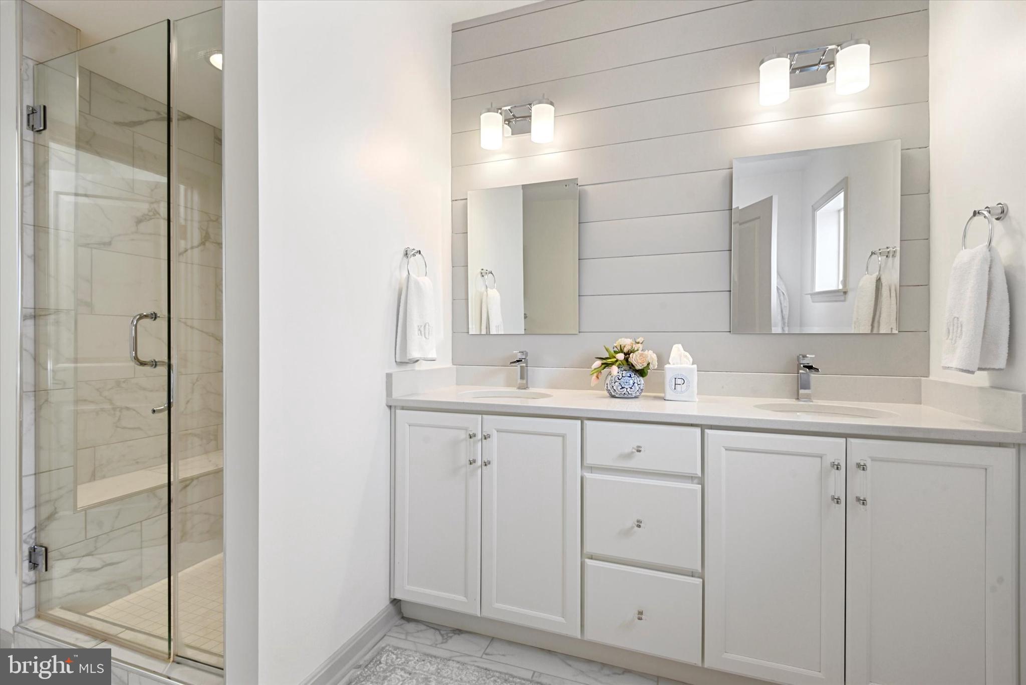 924 Lindley Road Frederick, MD 21701 - Photo 18 of 46 a bathroom with a double vanity sink and mirror