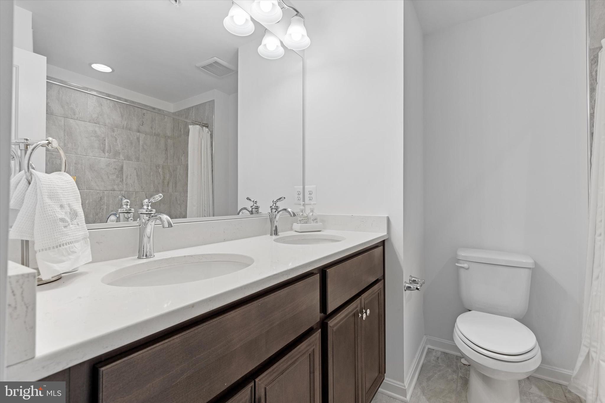 924 Lindley Road Frederick, MD 21701 - Photo 21 of 46 a bathroom with a sink and a toilet