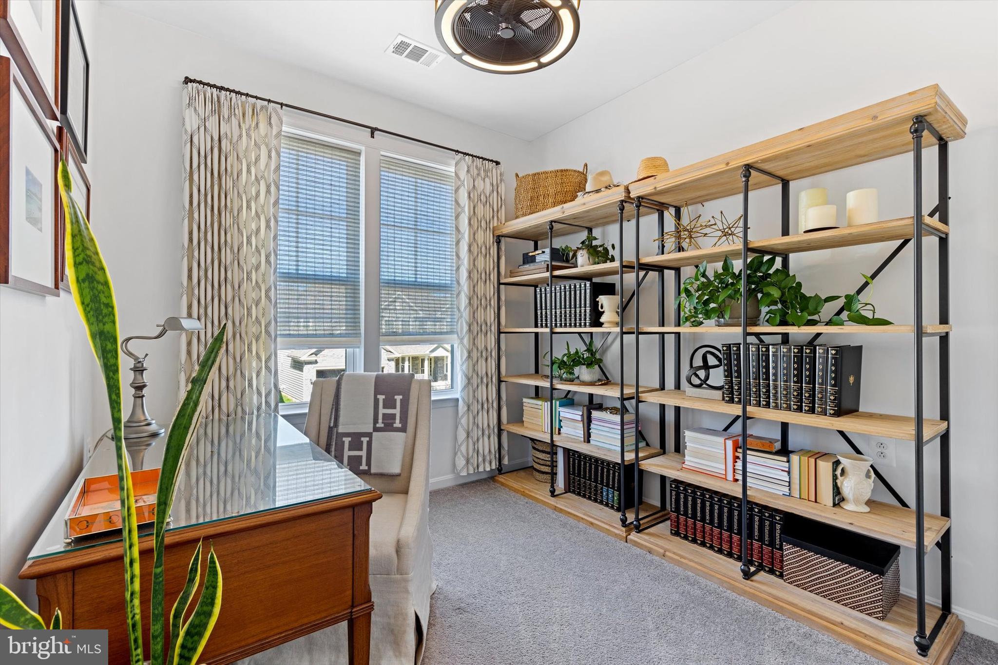 924 Lindley Road Frederick, MD 21701 - Photo 22 of 46 a view of staircase with furniture and a window