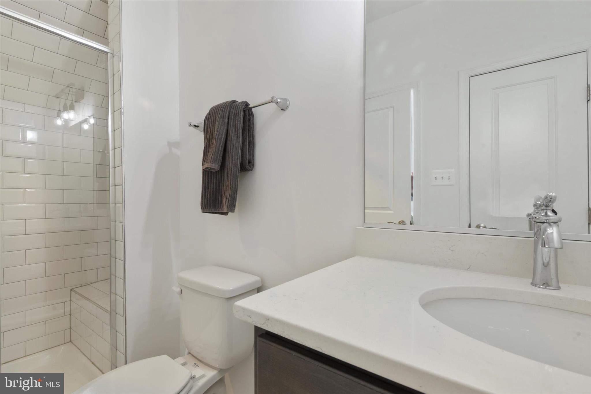 924 Lindley Road Frederick, MD 21701 - Photo 25 of 46 a bathroom with a sink a toilet and shower