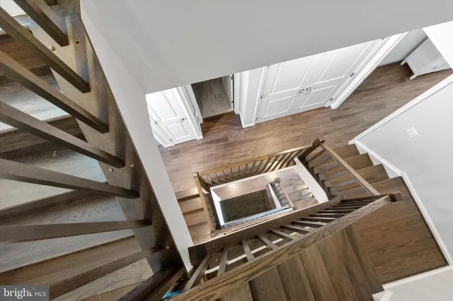 a living room with furniture and a ceiling fan