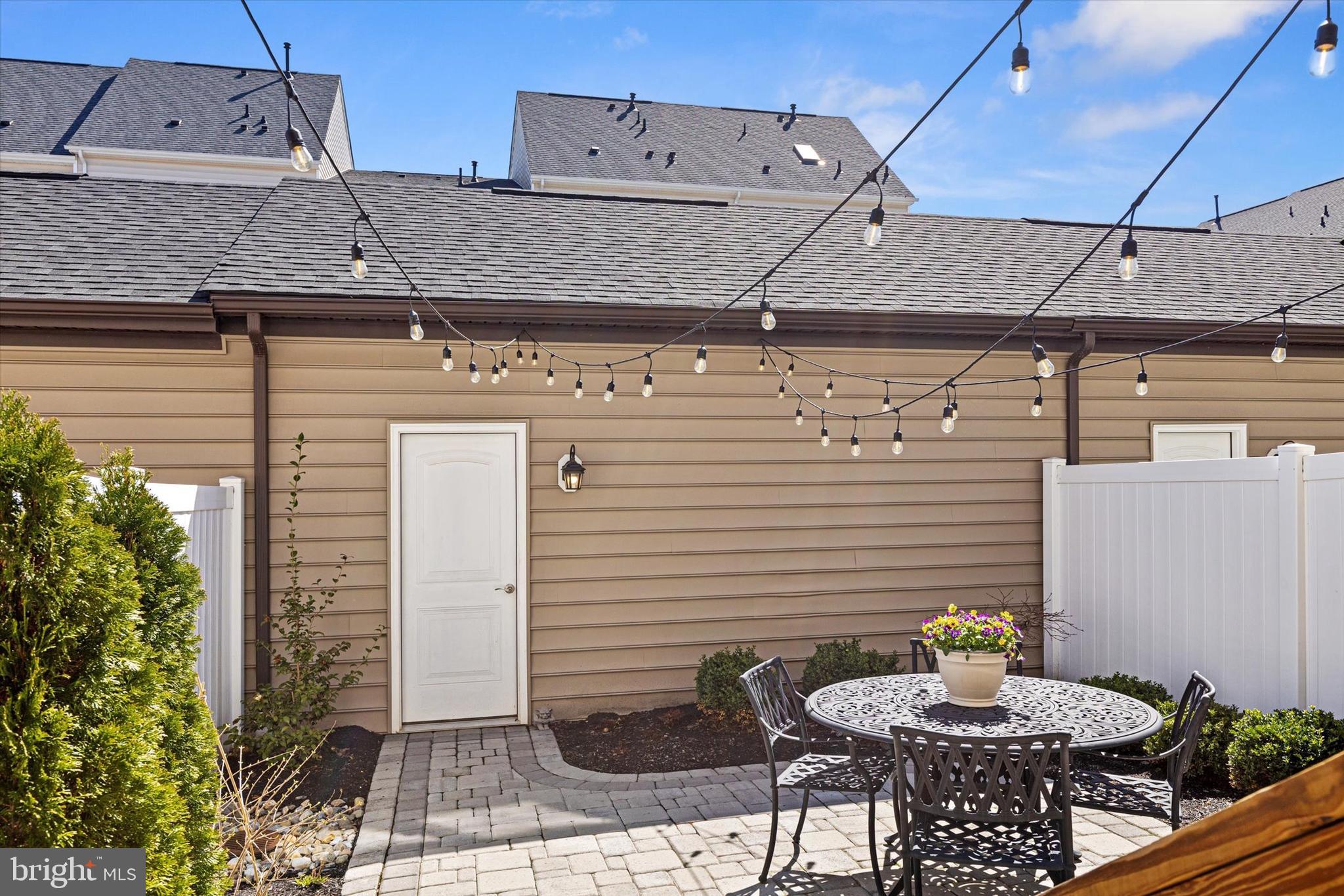924 Lindley Road Frederick, MD 21701 - Photo 34 of 46 a view of a patio with table and chairs potted plants