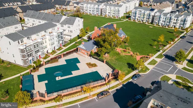 an aerial view of a house with yard swimming pool and outdoor seating