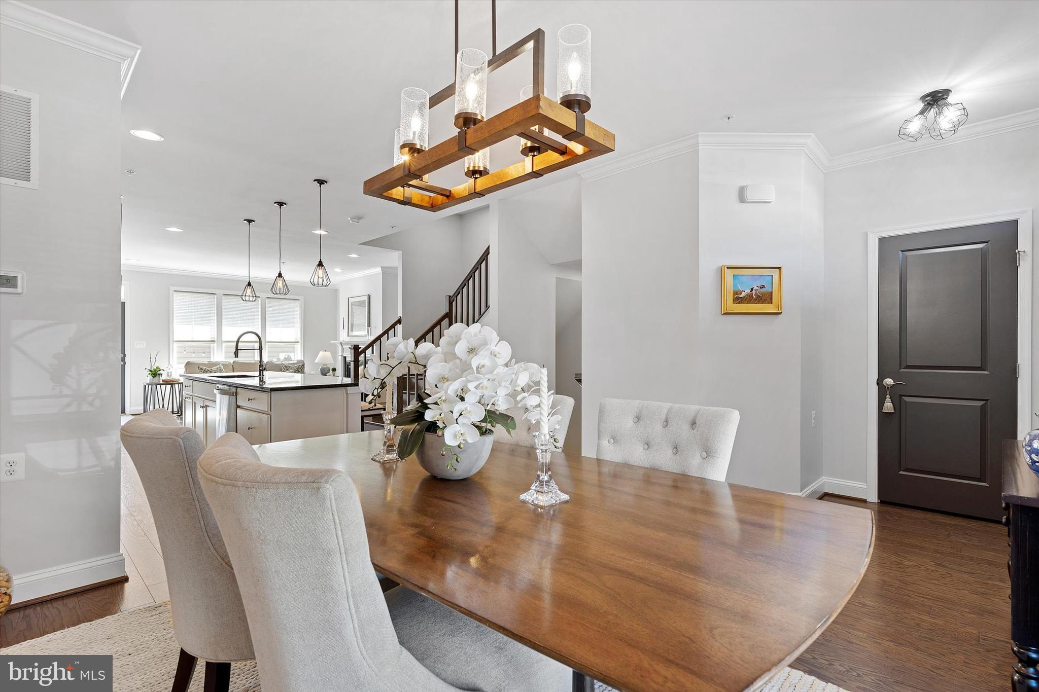 924 Lindley Road Frederick, MD 21701 - Photo 6 of 46 a dining room filled chandelier and kitchen view