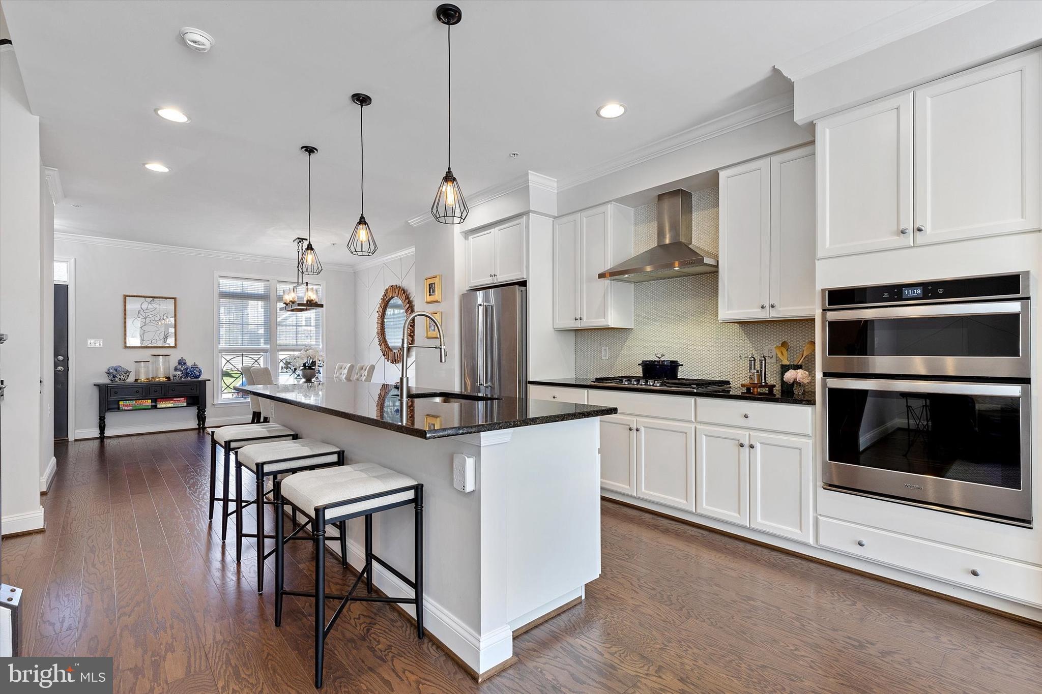 924 Lindley Road Frederick, MD 21701 - Photo 8 of 46 a kitchen with stainless steel appliances granite countertop a stove a sink a oven a refrigerator a stove and white cabinets with wooden floor