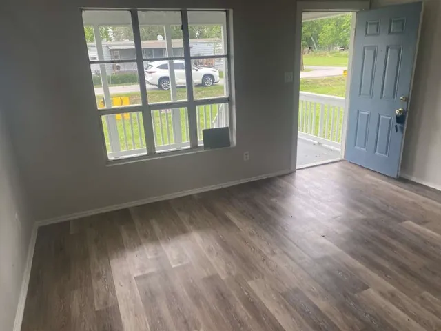 a view of an empty room and window