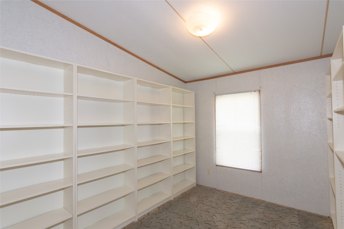 1 11209-tract Road Del Valle, TX 78617 - Photo 19 of 39 a room with walk in closet and window