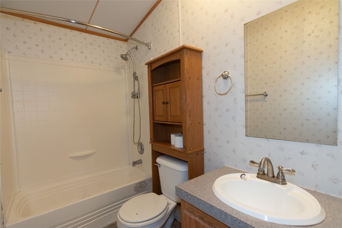 1 11209-tract Road Del Valle, TX 78617 - Photo 20 of 39 a bathroom with a sink toilet and shower