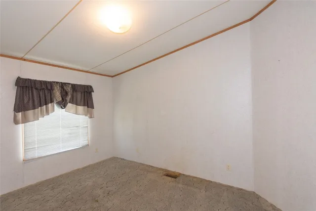 a view of deck with hardwood and trees