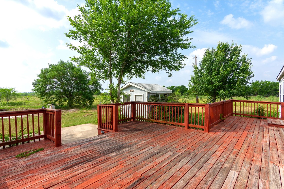 1 11209-tract Road Del Valle, TX 78617 - Photo 23 of 39 a view of deck with hardwood and trees