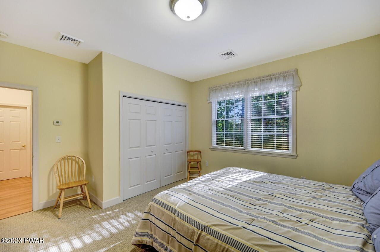 883 Goose Pond Road Lake Ariel, PA 18436 - Photo 38 of 70 a bedroom with a bed and a window