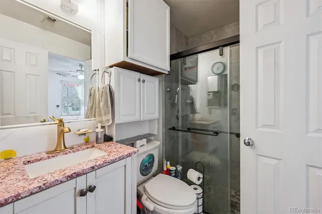 a bathroom with a toilet and a sink