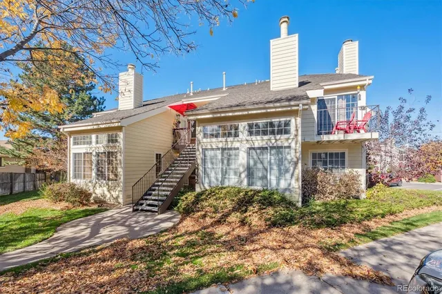 a front view of house with a garden