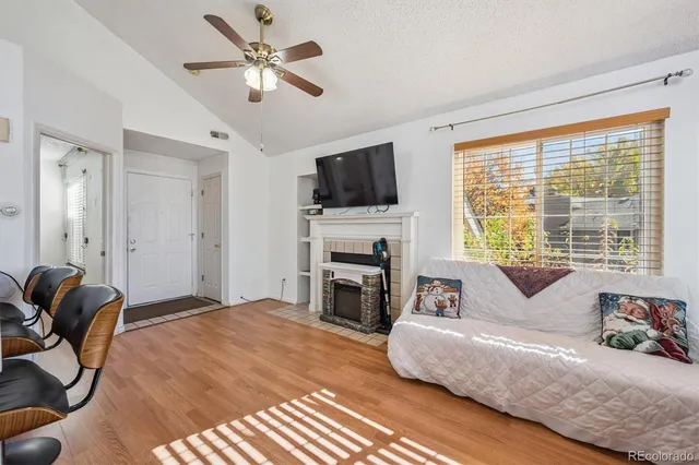 a living room with furniture fireplace and flat screen tv