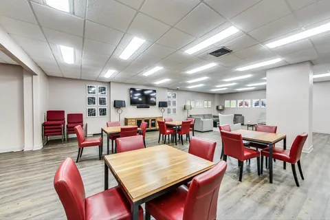 a room with furniture and pool table