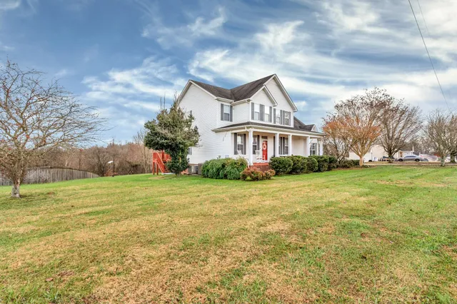 a front view of house with garden