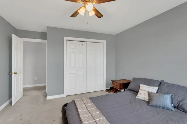 a bed room with a bed and a chandelier