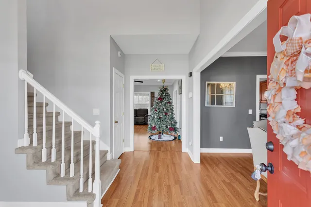 a view of entryway with wooden floor