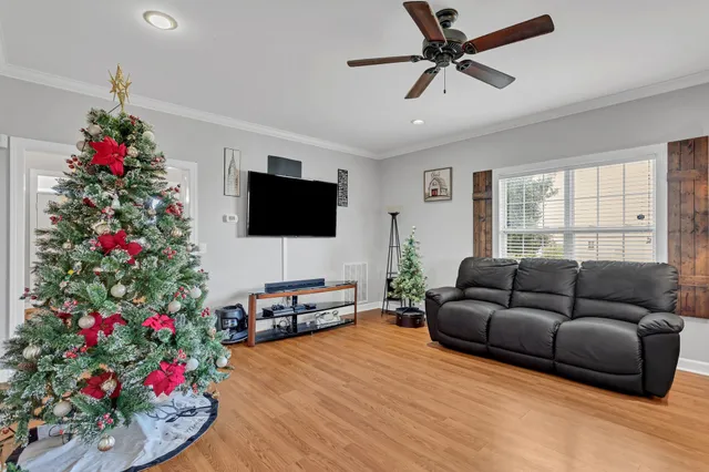 a living room with furniture and a flat screen tv