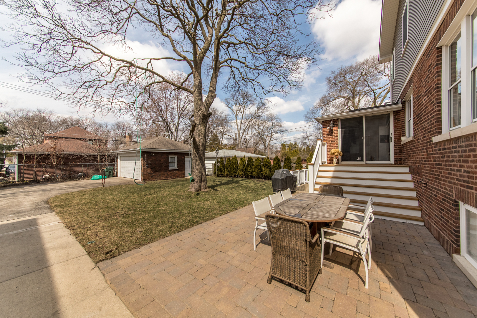 100 Wisner Street Park Ridge, IL 60068 - Photo 34 of 36 a view of a patio with table and chairs with wooden floor and fence