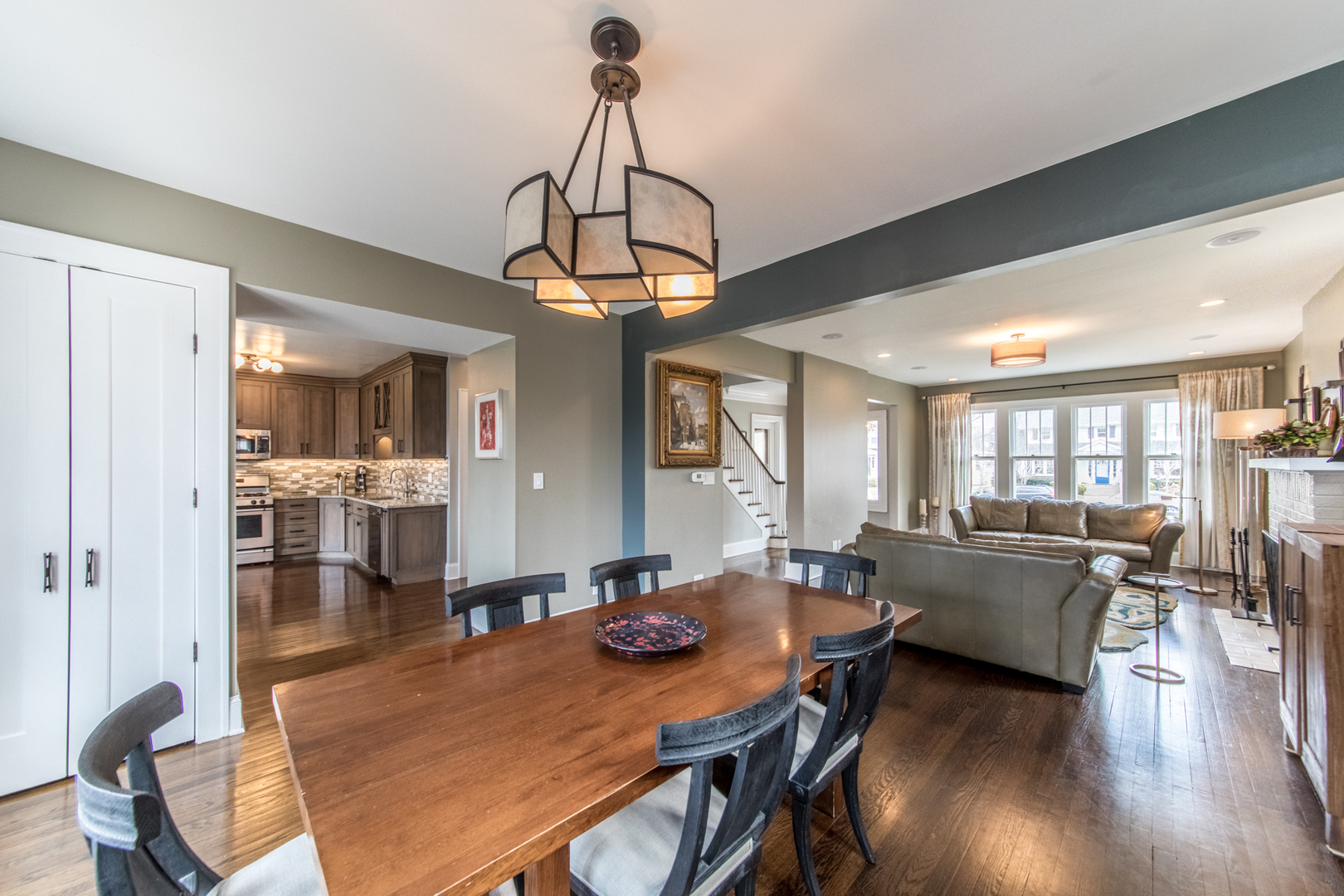 100 Wisner Street Park Ridge, IL 60068 - Photo 9 of 36 a view of a dining room and livingroom with furniture wooden floor a chandelier