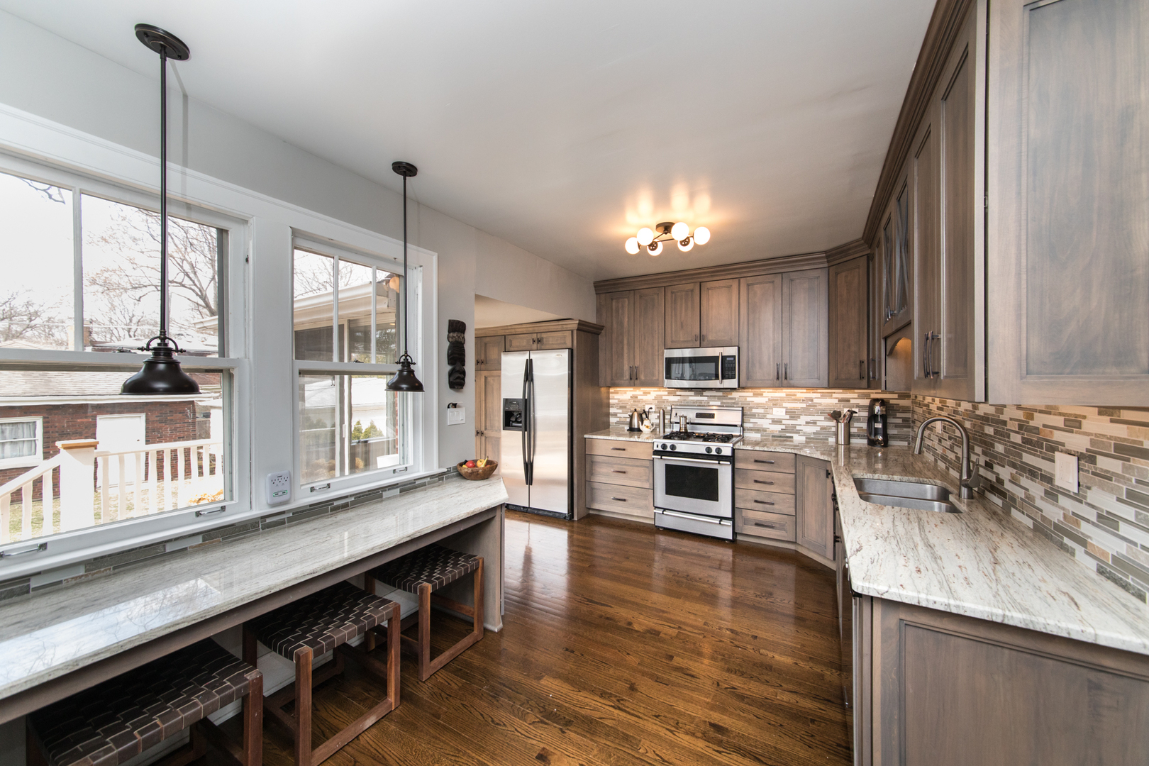100 Wisner Street Park Ridge, IL 60068 - Photo 10 of 36 a kitchen with stainless steel appliances granite countertop a stove and a sink