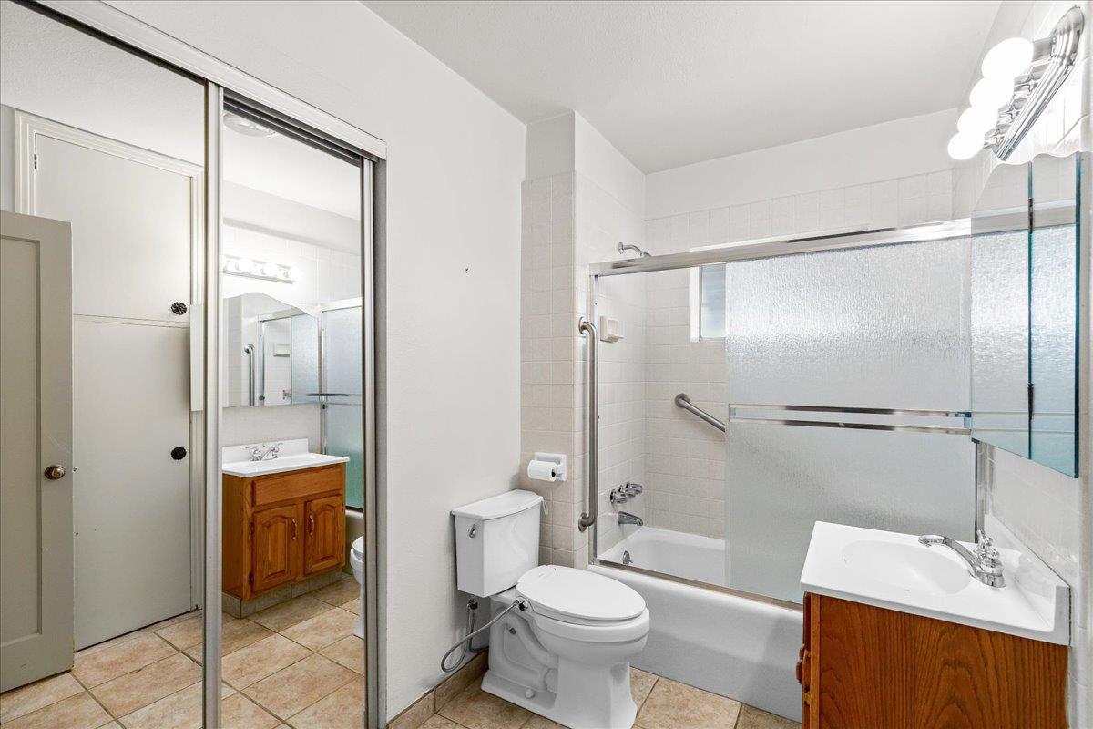 4701 Lone Tree Road Valley Home, CA 95361 - Photo 39 of 59 a bathroom with a sink a toilet and shower