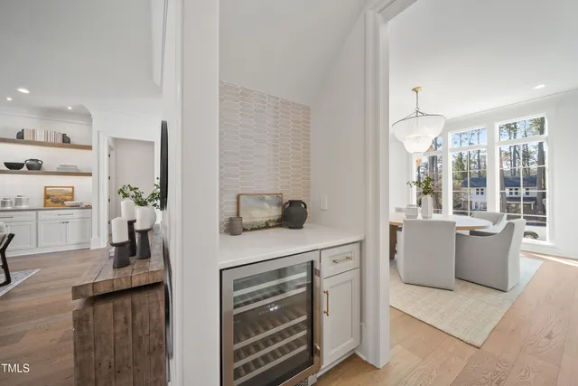 a kitchen with a stove and white cabinets