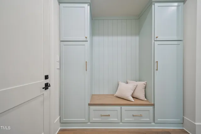 a view of bedroom with furniture and wooden floor