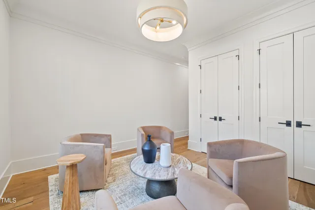 a living room with furniture and a mirror