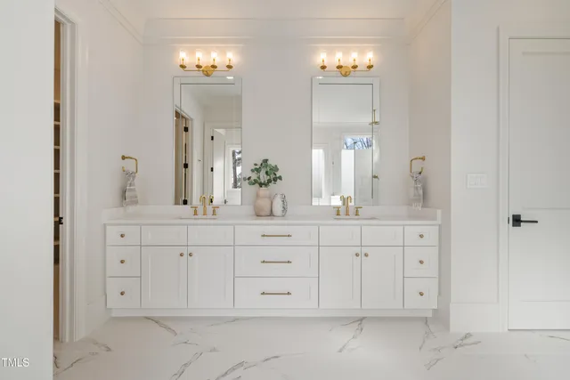 a spacious bathroom with double sink and a mirror