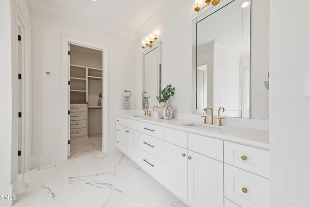 a bathroom with a double vanity sink a and a mirror