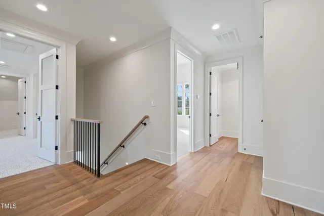 a view of hallway with wooden floor