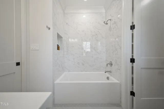 a living room with furniture and white walls