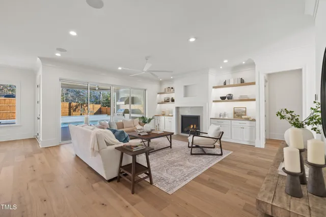 a living room with furniture fireplace and potted plant