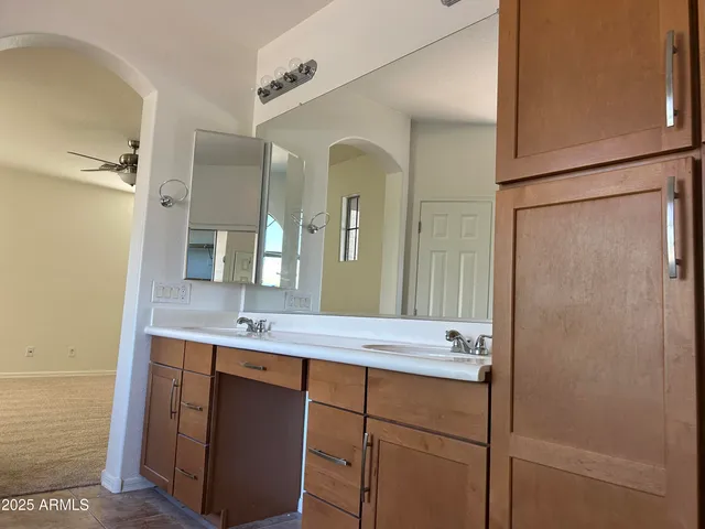 a bathroom with a granite countertop sink mirror and a