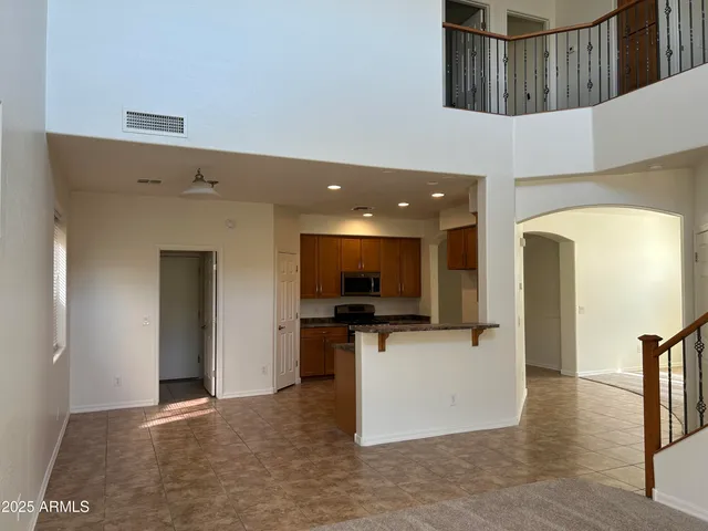 a view of living room with a flat screen tv and a fireplace