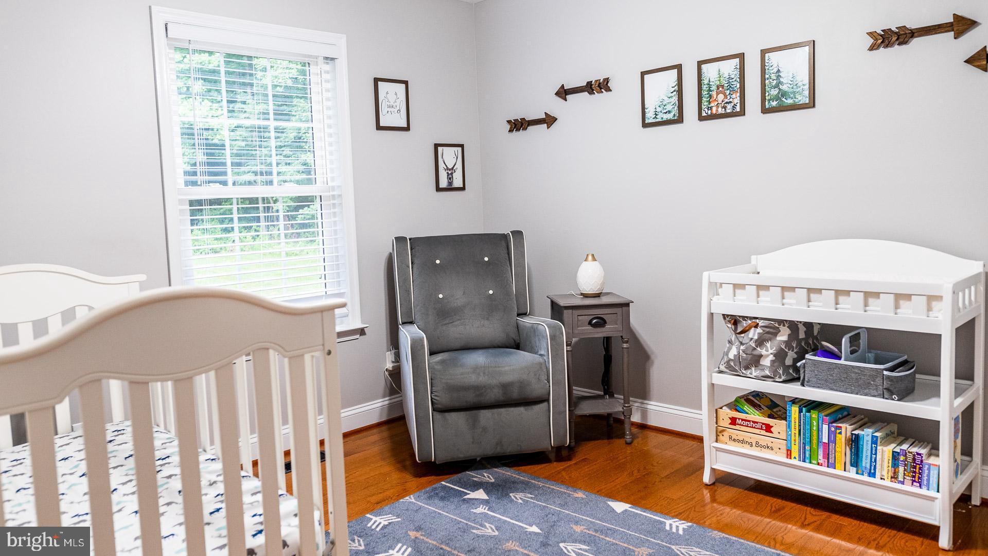 625 Carson Road Huntingtown, MD 20639 - Photo 10 of 21 a bedroom with furniture and a book shelf