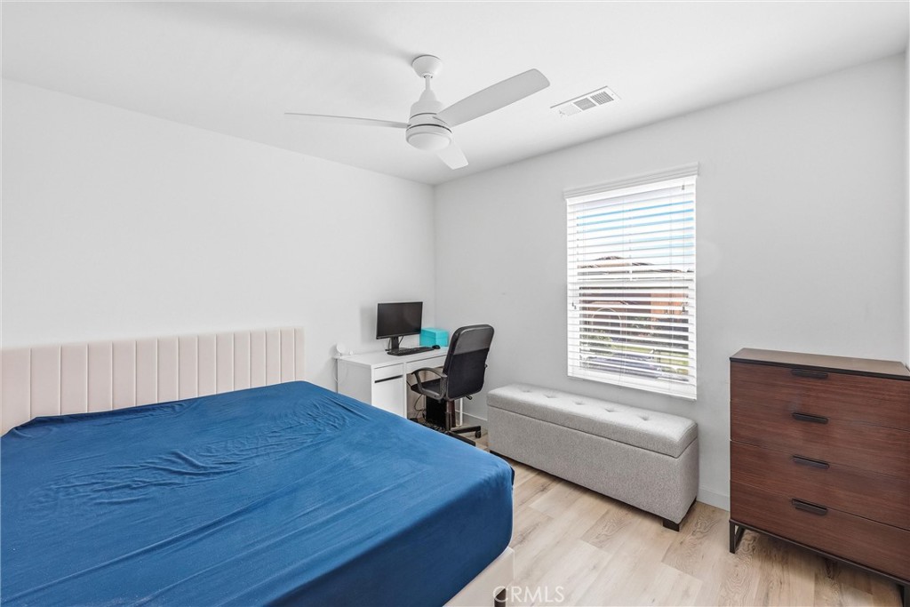 4783 Vanderham Way Eastvale, CA 91752 - Photo 15 of 29 a bedroom with a bed and a window