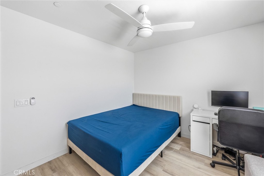 4783 Vanderham Way Eastvale, CA 91752 - Photo 16 of 29 a bedroom with a bed and a flat screen tv