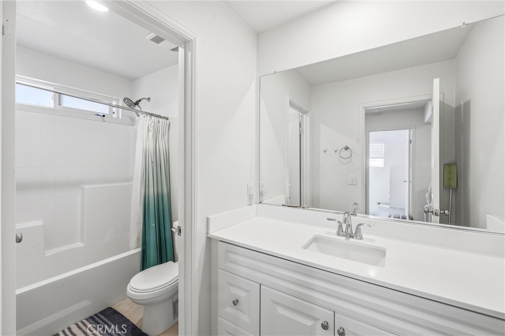 4783 Vanderham Way Eastvale, CA 91752 - Photo 18 of 29 a bathroom with a sink toilet and shower