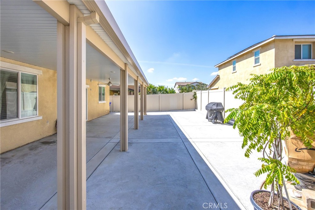 4783 Vanderham Way Eastvale, CA 91752 - Photo 25 of 29 a view of a house with a backyard