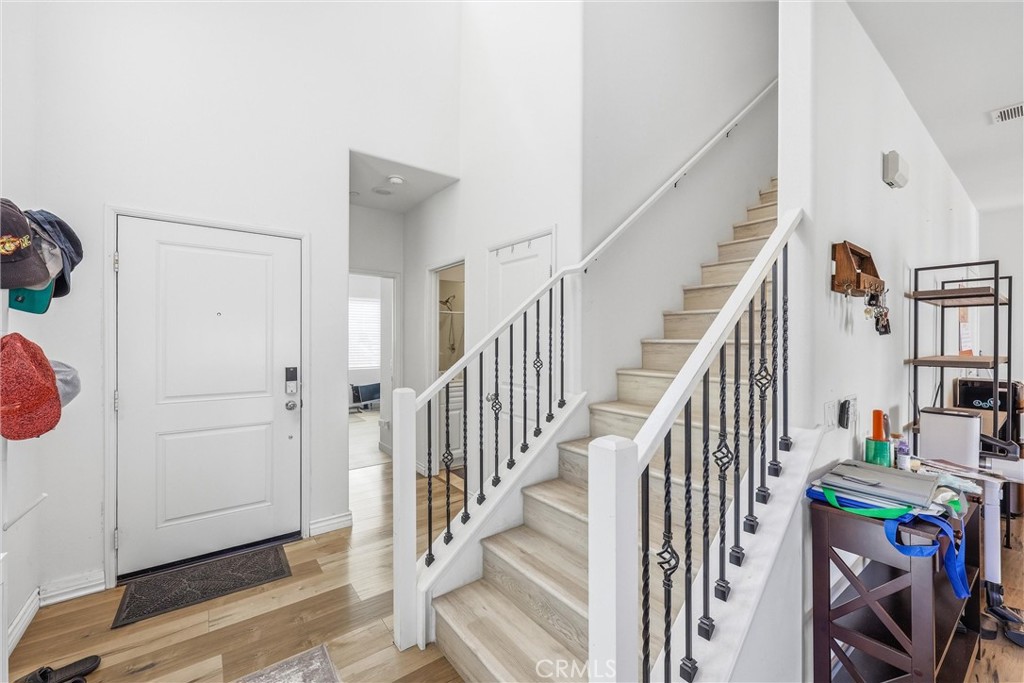 4783 Vanderham Way Eastvale, CA 91752 - Photo 4 of 29 a view of an entryway with wooden floor and livingroom view