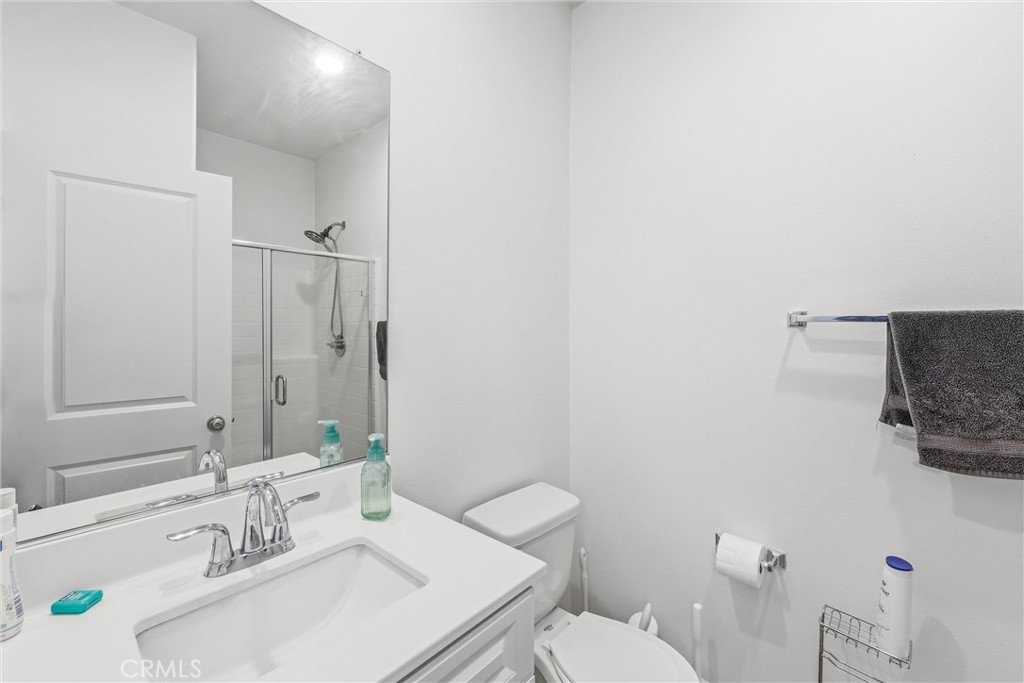 4783 Vanderham Way Eastvale, CA 91752 - Photo 6 of 29 a bathroom with a sink vanity mirror and toilet