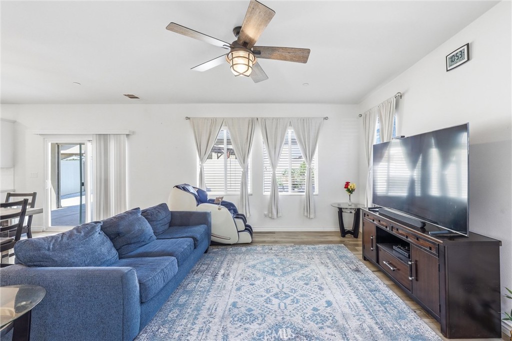 4783 Vanderham Way Eastvale, CA 91752 - Photo 7 of 29 a living room with furniture and a flat screen tv
