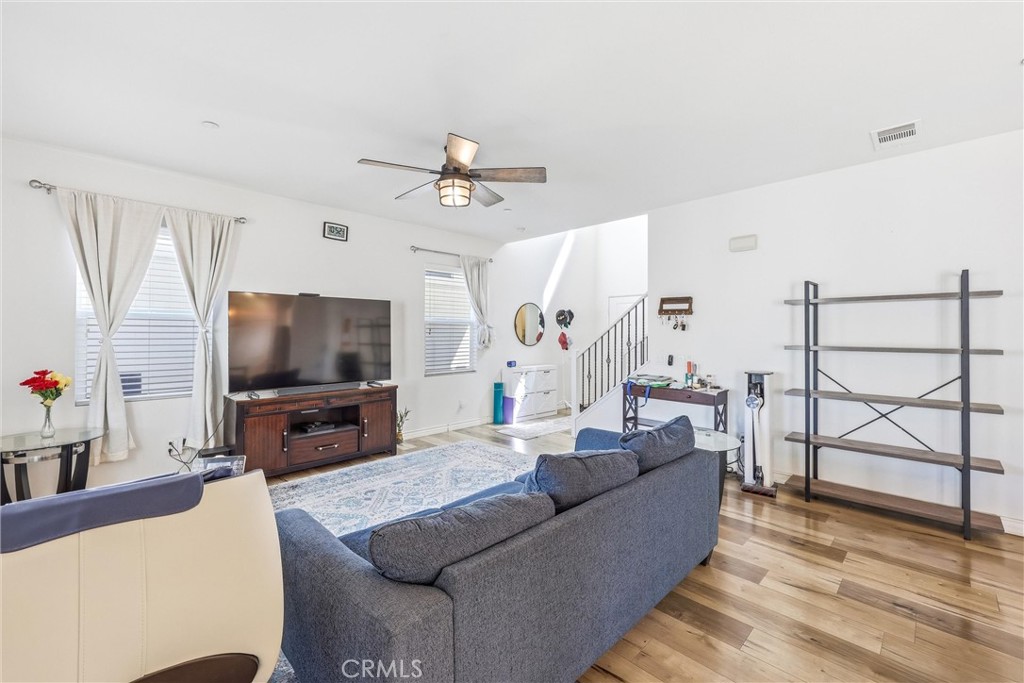 4783 Vanderham Way Eastvale, CA 91752 - Photo 9 of 29 a living room with furniture and a flat screen tv