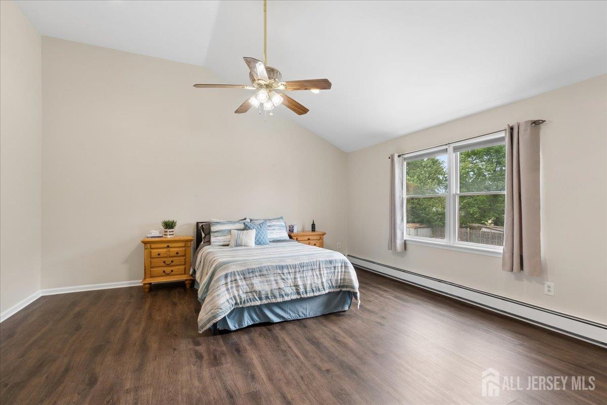 45 Walnut Street Edison, NJ 08817 - Photo 16 of 28 a bedroom with a bed and wooden floor