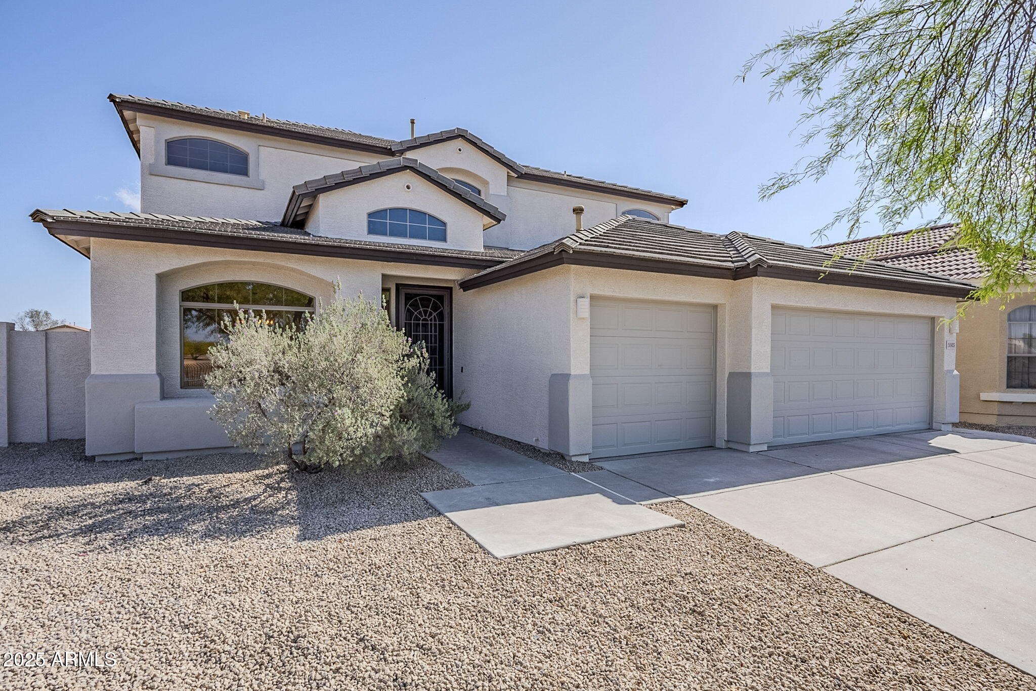 5503 West Carson Road Laveen, AZ 85339 - Photo 1 of 56 a front view of a house with a garage