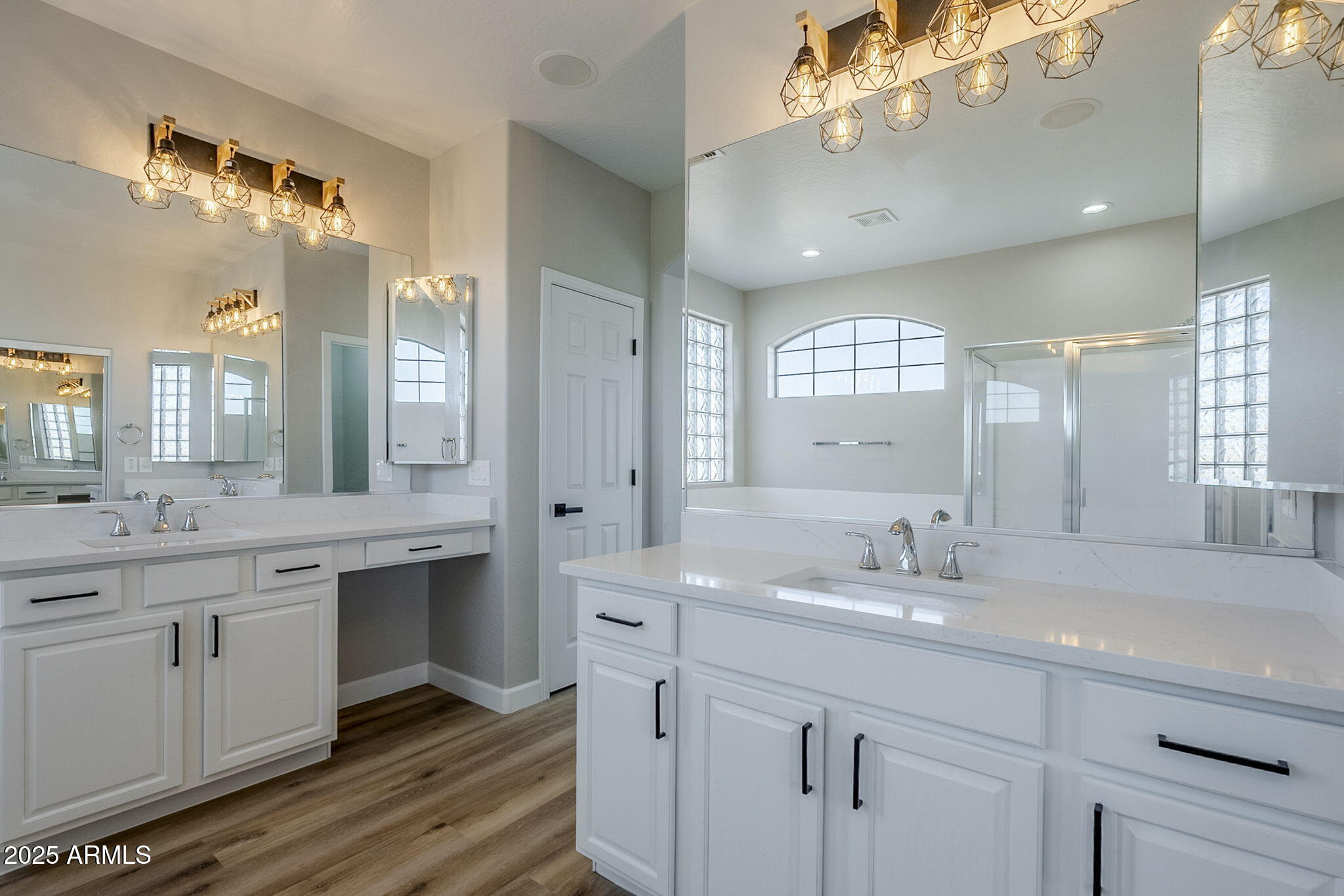 5503 West Carson Road Laveen, AZ 85339 - Photo 30 of 56 a bathroom with a double vanity sink and a mirror